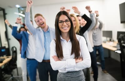 business people celebrating success at company